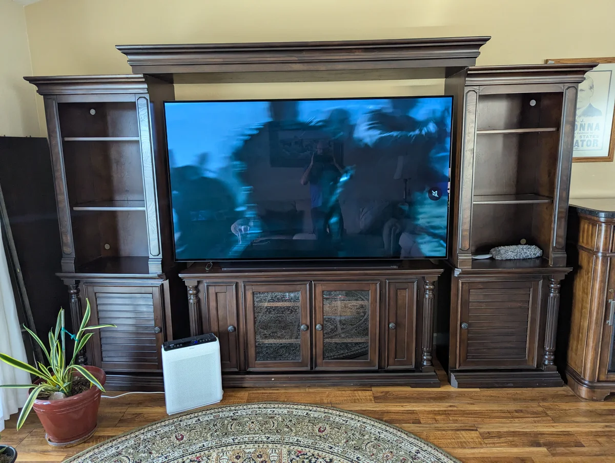 Entertainment center before WubWub Audio custom speaker installation showing empty cabinets