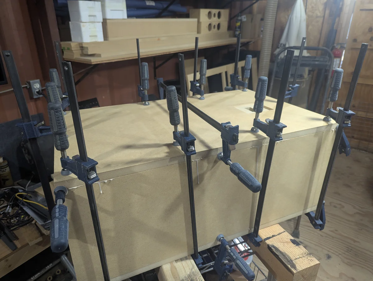 WubWub Audio speaker cabinet being glued and clamped during assembly in our Arizona workshop