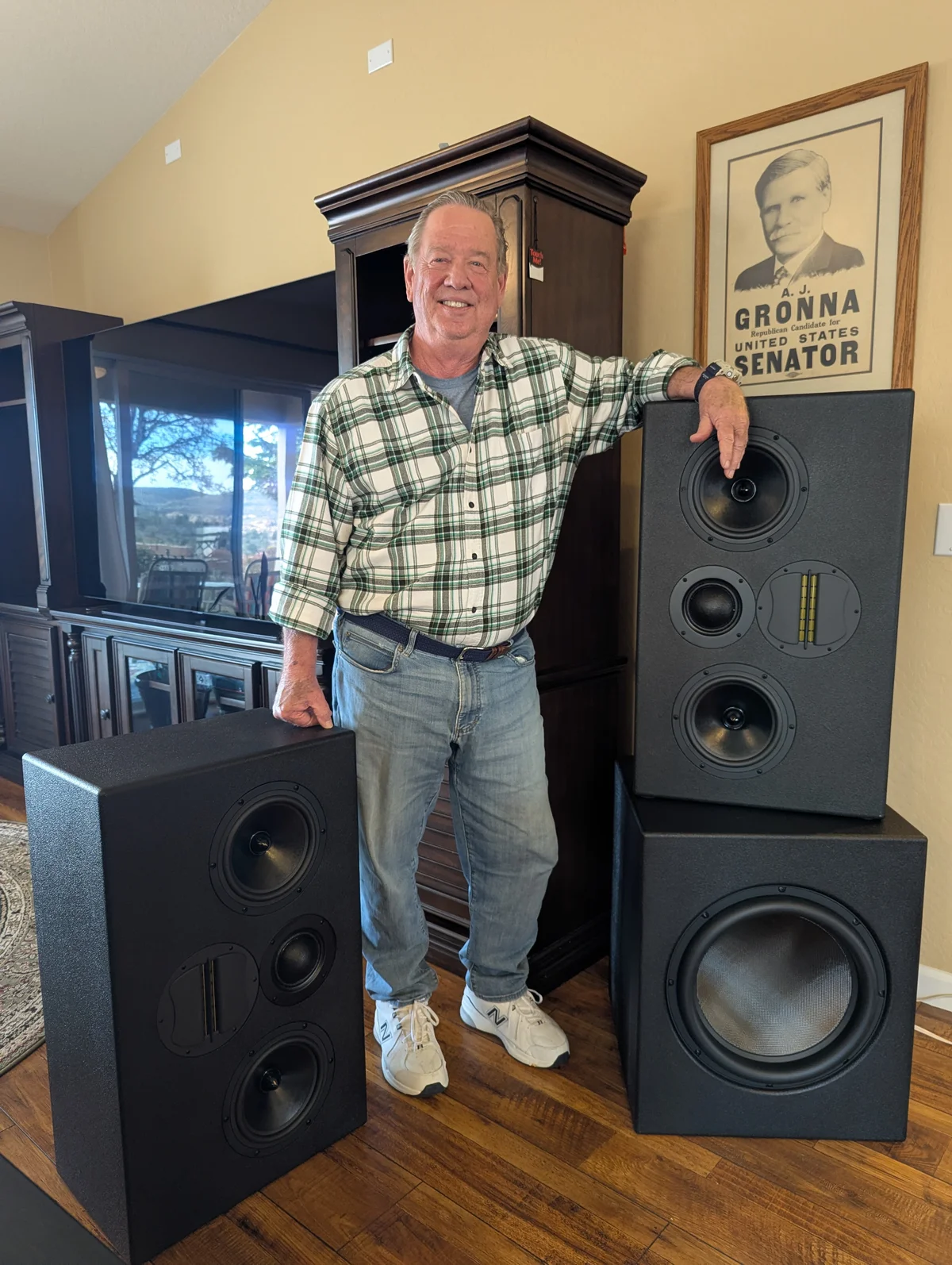 Happy client with complete WubWub Audio custom speaker set including tower bookshelf and subwoofer