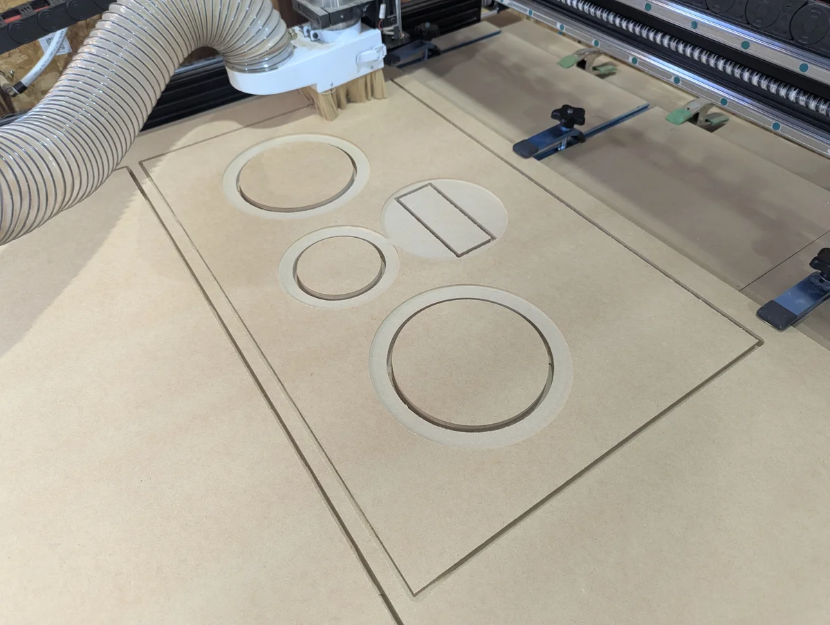 CNC router cutting speaker baffle panel with driver and port cutouts for WubWub Audio speaker