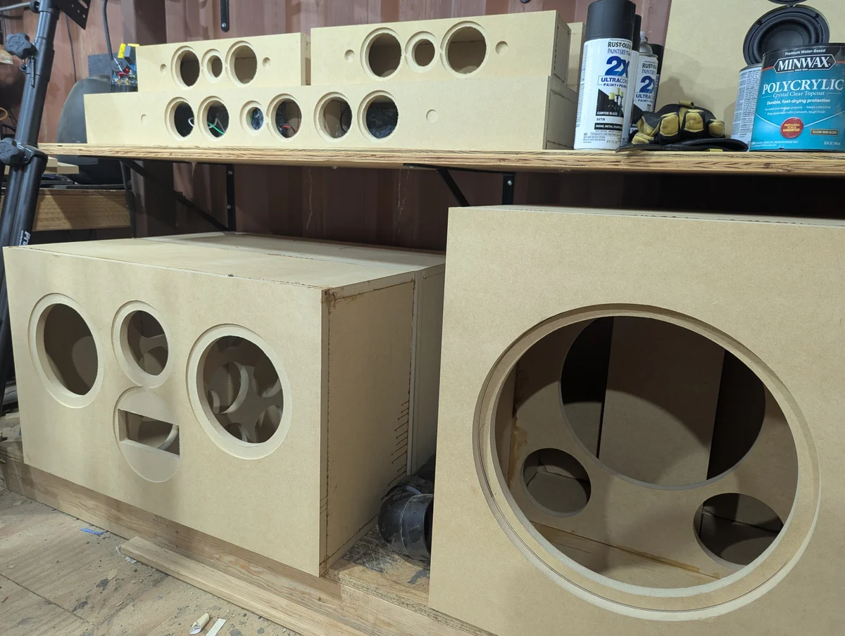 Complete set of WubWub Audio speaker cabinets assembled showing center channel bookshelf and subwoofer