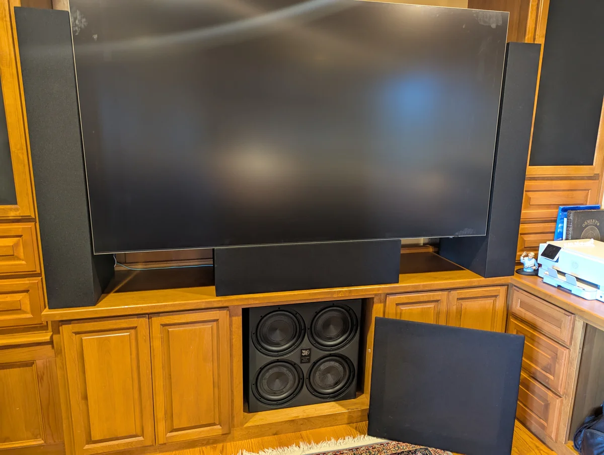WubWub Audio quad subwoofer installed in custom cabinet below display in home theater