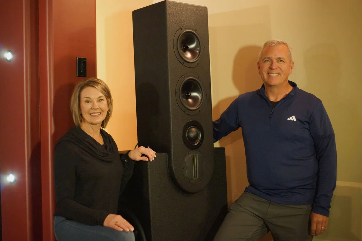 Sedona homeowners with their completed custom WubWub Audio tower speaker